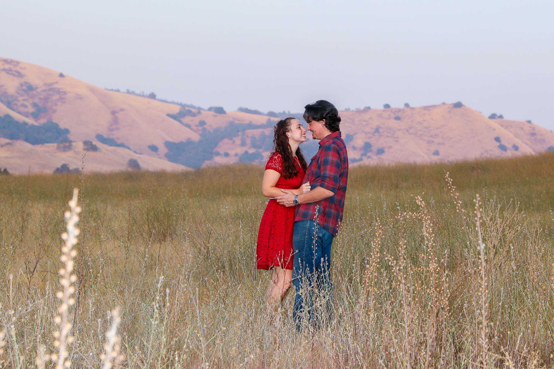Couple in coordinated outfits during engagement session
